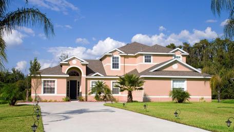 Charming Mansion Surrounded by Lush Greenery wallpaper