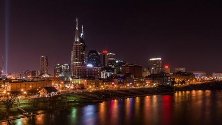 Nashville's Vibrant Nighttime Skyline by the River wallpaper