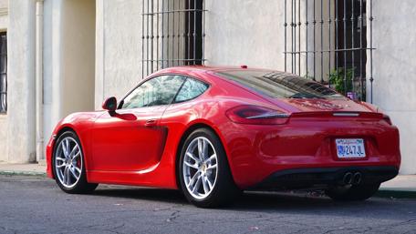 Sleek Red Porsche Cayman Design wallpaper