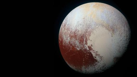 Pluto's Enigmatic Beauty in the Cosmos wallpaper