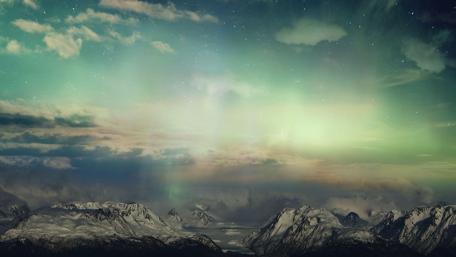 Majestic Aurora Over Snowy Mountains wallpaper