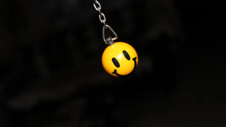 Suspenseful Smile in the Shadows wallpaper