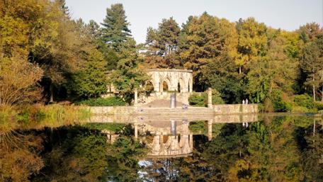 Serene Reflection Over a Tranquil Lake wallpaper