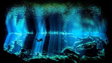 Mystical Underwater Cave Exploration wallpaper