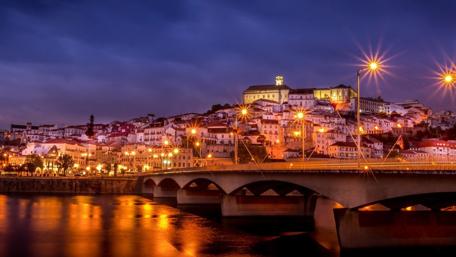 Enchanting Night View of Coimbra Cityscape wallpaper