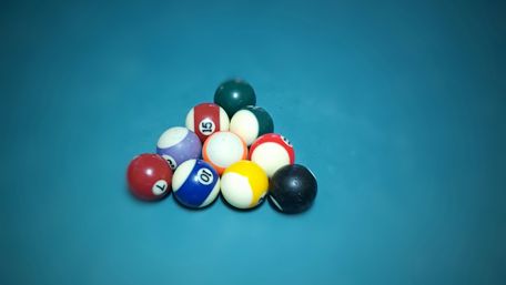 Dynamic Pool Balls on a Felt Surface wallpaper