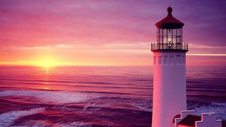 Majestic Sunset by the Lighthouse wallpaper