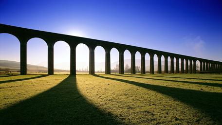 Ancient Aqueduct in Golden Meadow wallpaper