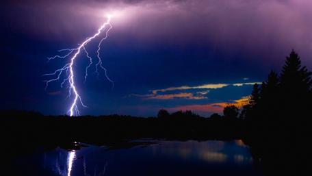 Stunning Lightning Dance Over a Serene Night Sky wallpaper