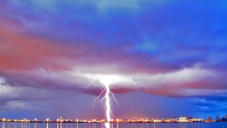 Electric Storm Over a Cityscape at Dusk wallpaper