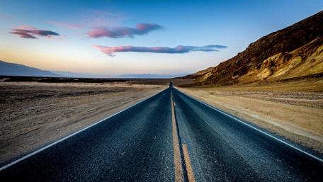 Endless Road Through Desert Landscape wallpaper