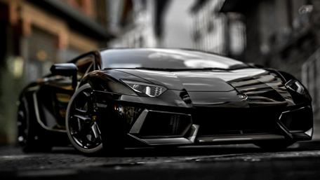 Sleek Black Sports Car Dominates the Street wallpaper