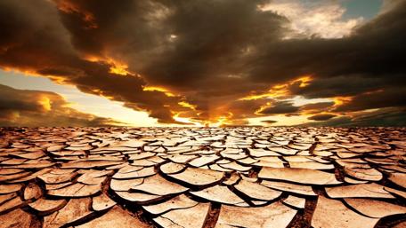 Desert Sunset Over Cracked Earth wallpaper