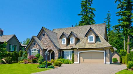 Charming Mansion Surrounded by Lush Greenery wallpaper