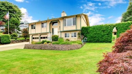 Dreamy Mansion Surrounded by Lush Greenery wallpaper