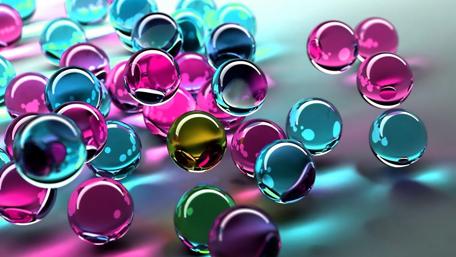 Vibrant Spheres Dance on Shimmering Surface wallpaper