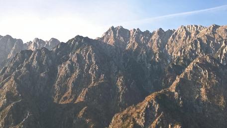 Majestic Mountain Peaks Overlooking a Serene Landscape wallpaper