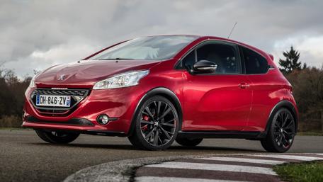 Sleek Red Peugeot on the Track wallpaper