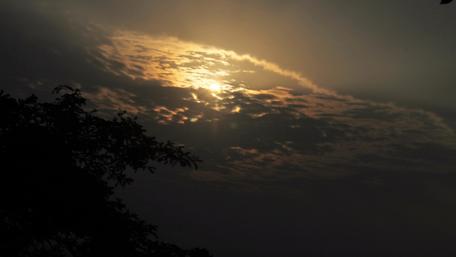Mysterious Sunset Amidst Cloudy Skies wallpaper