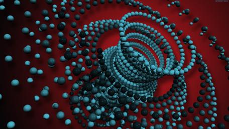 Dynamic Spirals of Colorful Spheres in Motion wallpaper