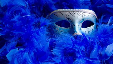 Vibrant Carnival Mask amidst Feathers wallpaper