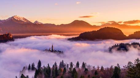 Majestic Mountains and Misty Valleys wallpaper