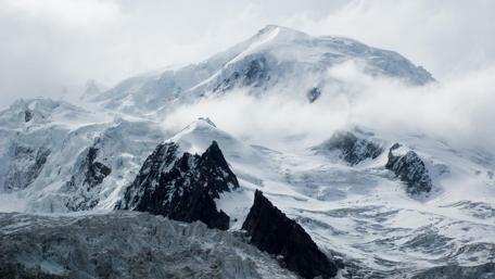 Majestic Peaks of Mont Blanc in Clouds wallpaper