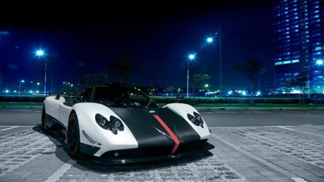 Sleek Luxury Supercar at Night Scene wallpaper