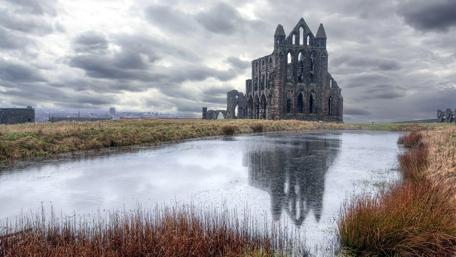 Ruins Reflected: Whitby Abbey's Serene Majesty wallpaper