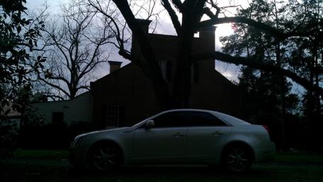 Sleek Cadillac CTS Against Dramatic Sky wallpaper
