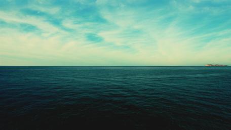 Endless Blue Horizon Over Tranquil Waterscape wallpaper