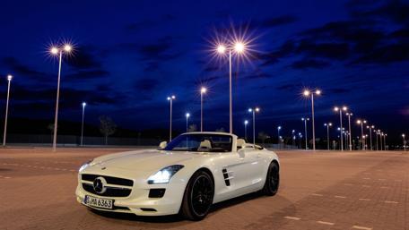Sleek Mercedes Car Under Dramatic Night Sky wallpaper