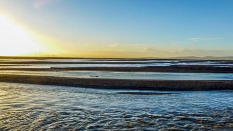 Serene Icelandic Waterway Under a Vibrant Sky wallpaper