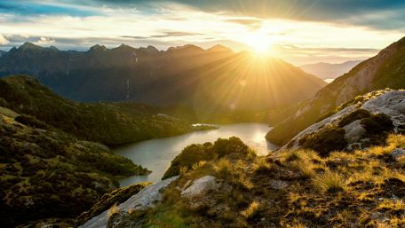 Breathtaking Sunrise Over Fiordland Lake wallpaper