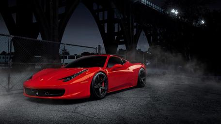 Fierce Red Dream Car Under Dark Sky wallpaper