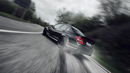 Blazing Speed on Curved Asphalt wallpaper