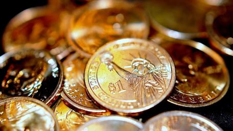 Golden Coins Symbolizing Wealth and Prosperity wallpaper