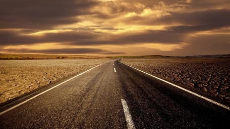 Desert Road Under Sunset Skies wallpaper