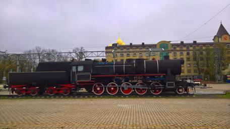 Classic Steam Locomotive in Urban Setting wallpaper