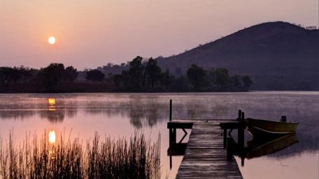 Serene Sunset at the Lake Dock wallpaper