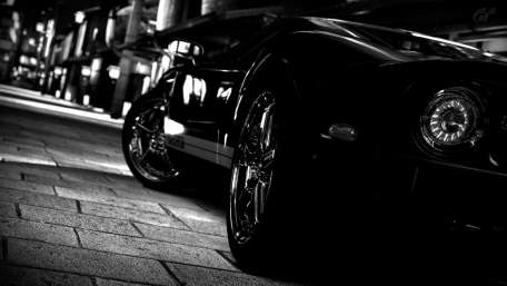 Sleek Monochrome Elegance of an Urban Car Scene wallpaper