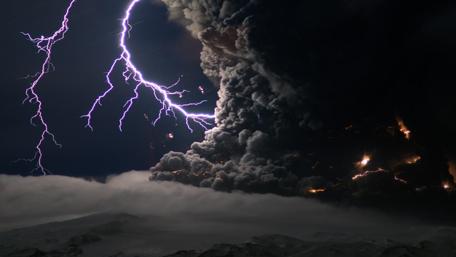 Electrifying Storm Over Volcanic Landscape wallpaper
