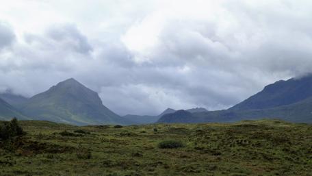 Serene Scottish Highlands Under Cloudy Skies wallpaper