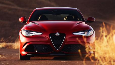 Dynamic Red Alfa Giulia on the Open Road wallpaper