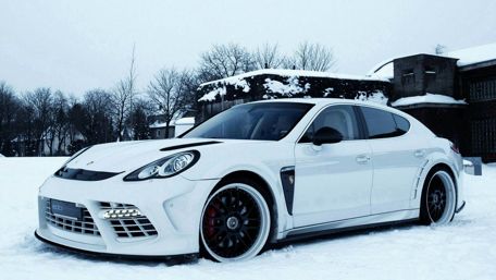Sleek Dream Car in a Winter Wonderland wallpaper