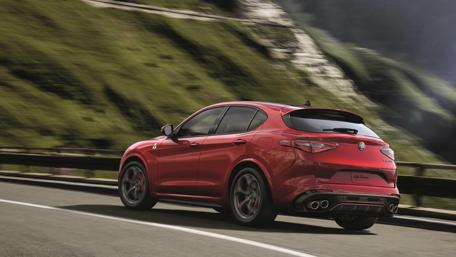 Italian Red Luxury Performance SUV on the Road wallpaper