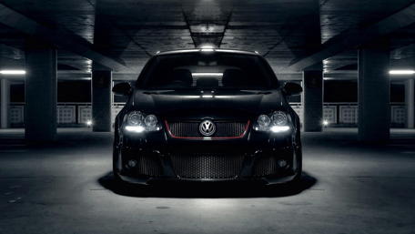 Sleek Volkswagen in a Dimly Lit Garage Scene wallpaper
