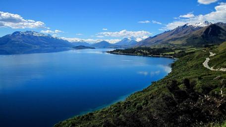 Breathtaking Coastal Landscape with Azure Waters and Mountains wallpaper