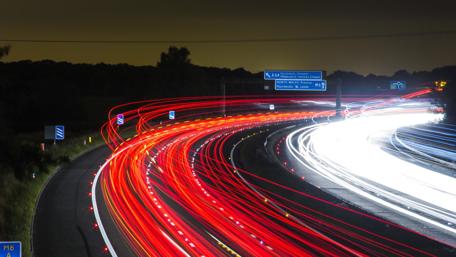 Vibrant Night Highway Glow Full of Motion wallpaper
