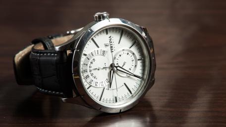 Elegant Men's Watch on a Dark Table Surface with Metal Finish wallpaper